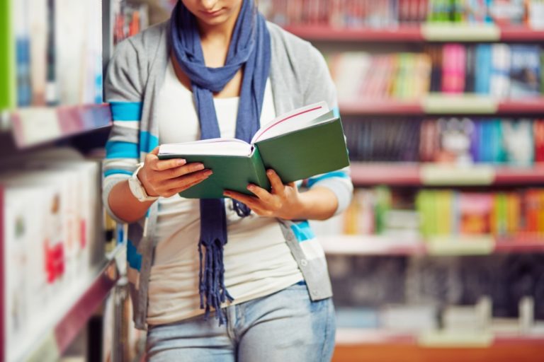 woman reading in library