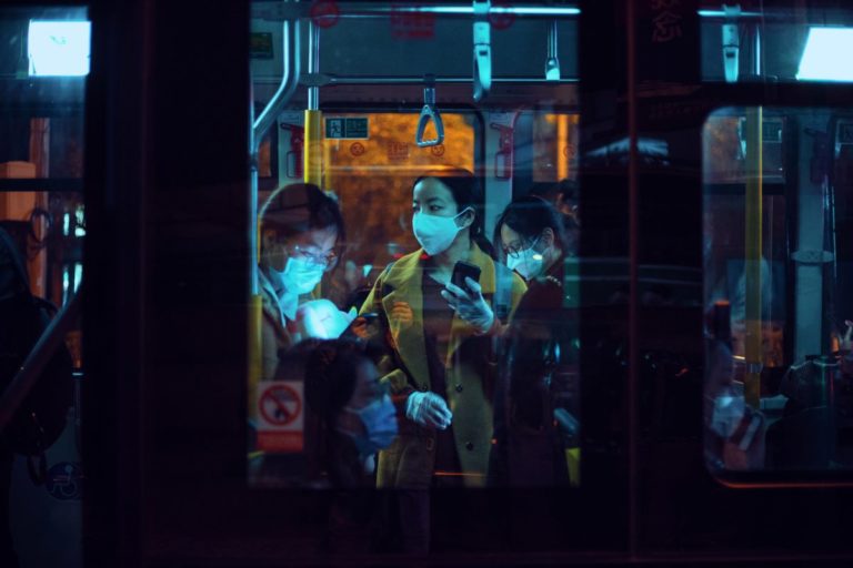 people wearing face mask in public transportation